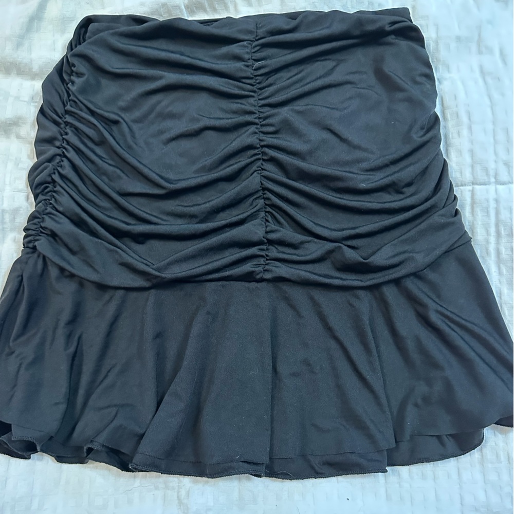 Ruffled pull on black mini skirt.